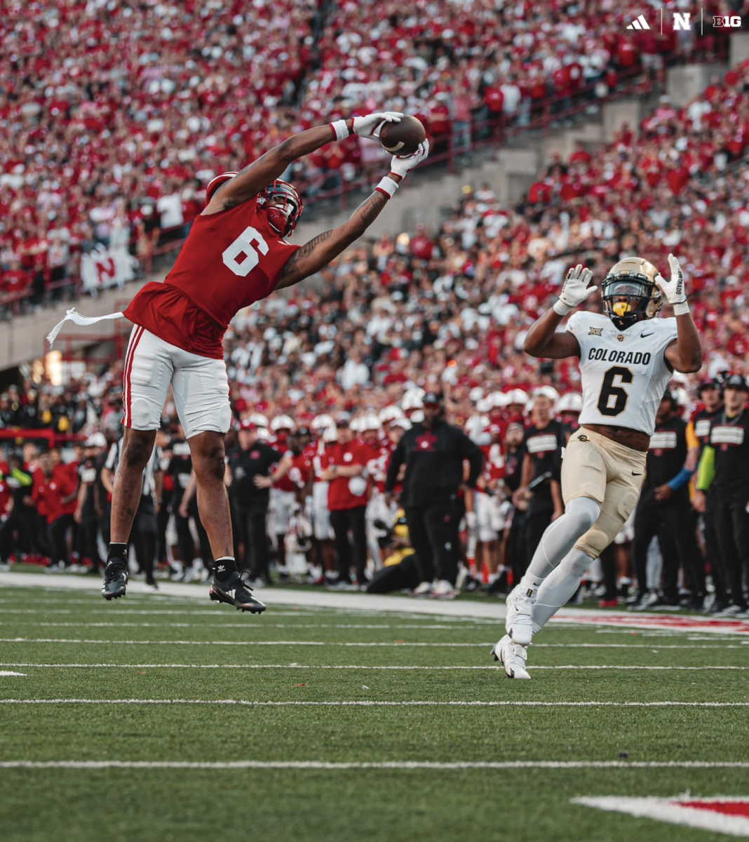 6 for 6: Nebraska Cornhuskers defensive back Tommi Hill catches an interception against Colorado. This catch ended up as a Pick Six, which further cemented their lead. 